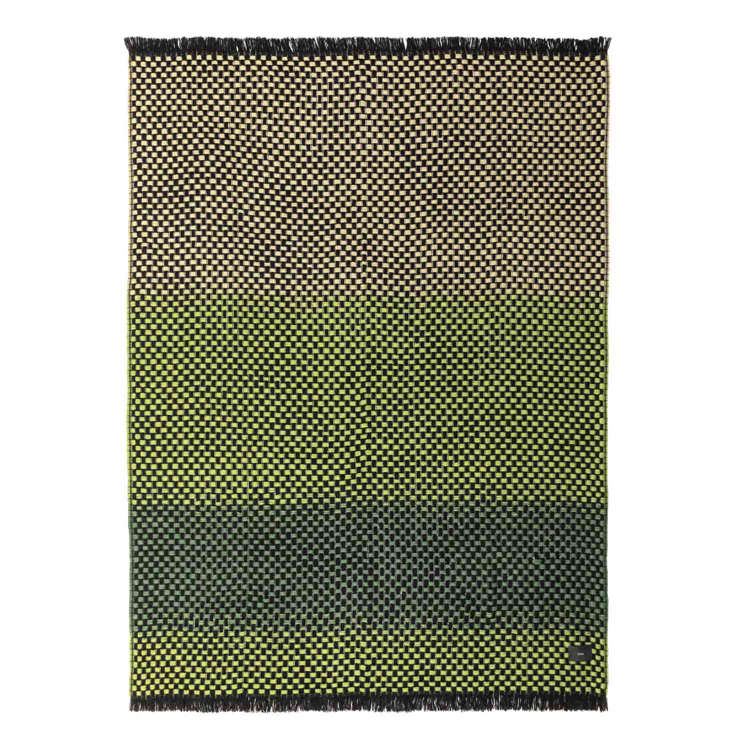 A rectangular blanket with a geometric pattern in shades of green, black, and gray, finished with twisted fringe.