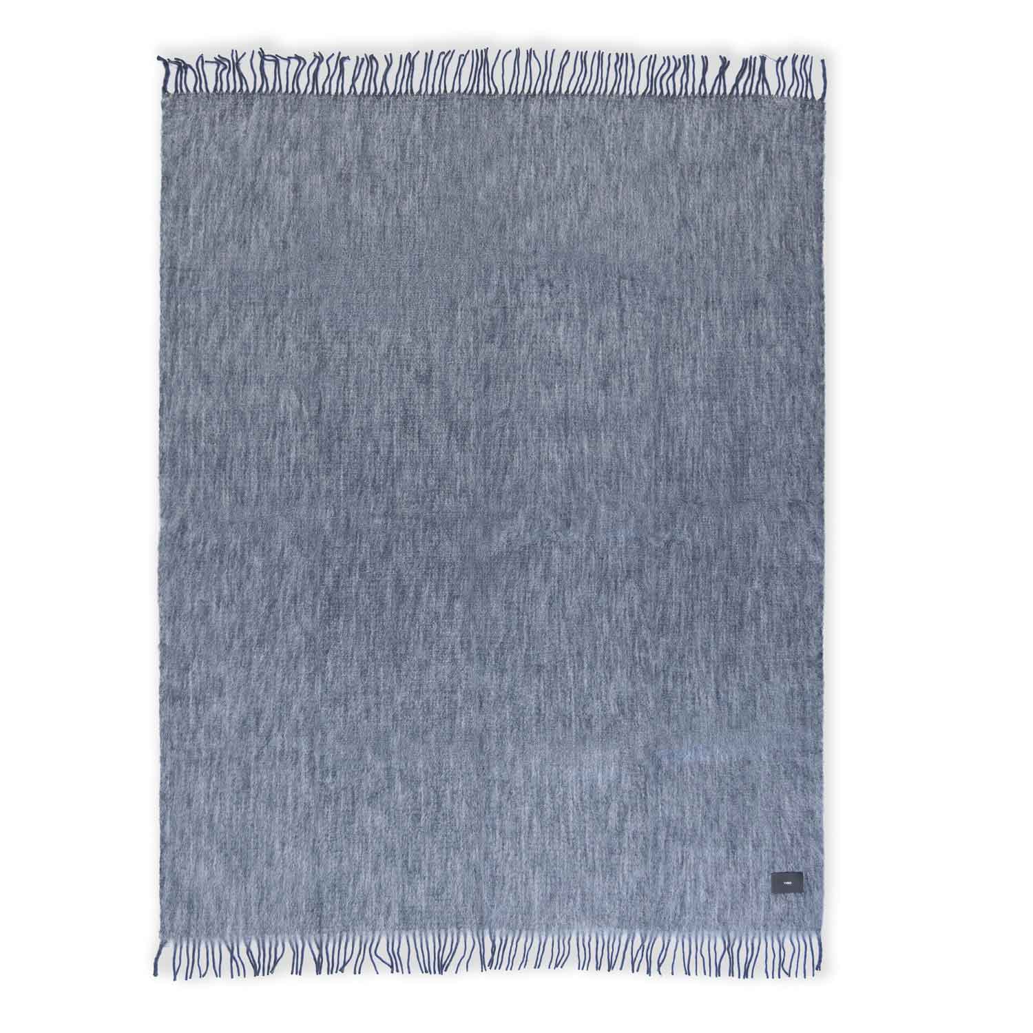 A grey mohair blanket with fringes, laid flat.
