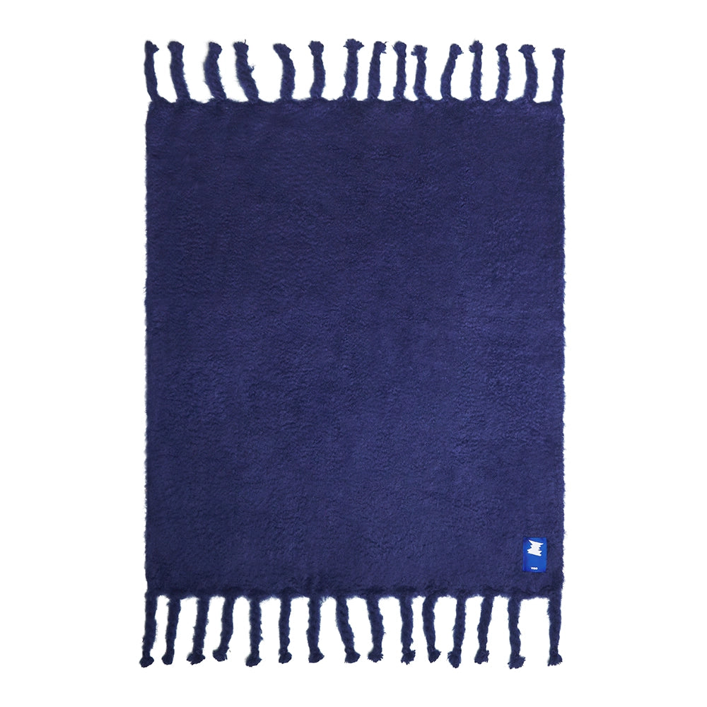 Navy blue mohair blanket on a white background