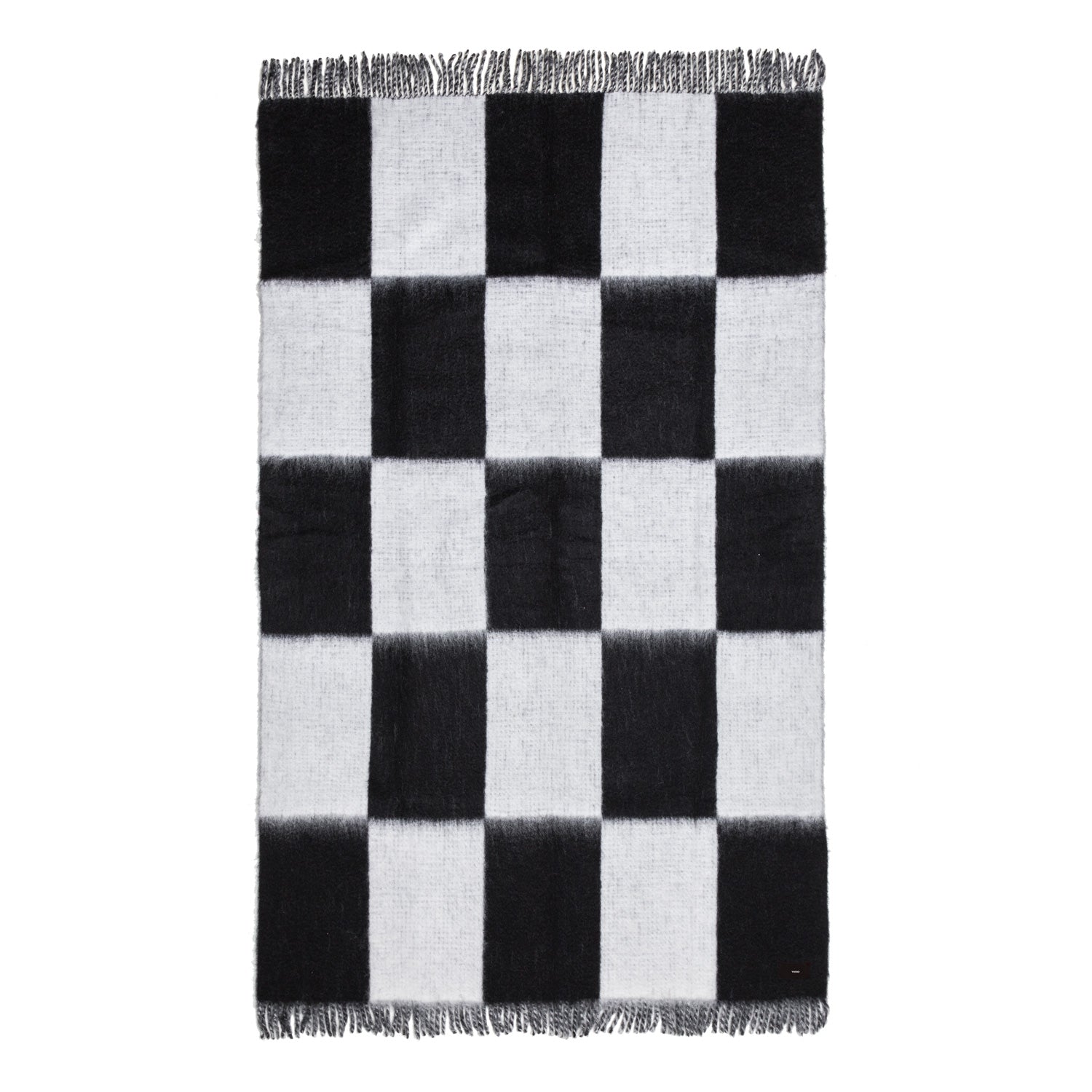 A black and white checkered mohair blanket with fringes, displayed on a plain background.