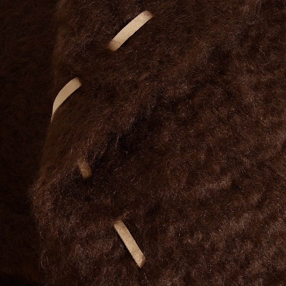 Close-up of a chocolate textured mohair fabric with visible stitching in cream – Ready to Hang X Viso Project