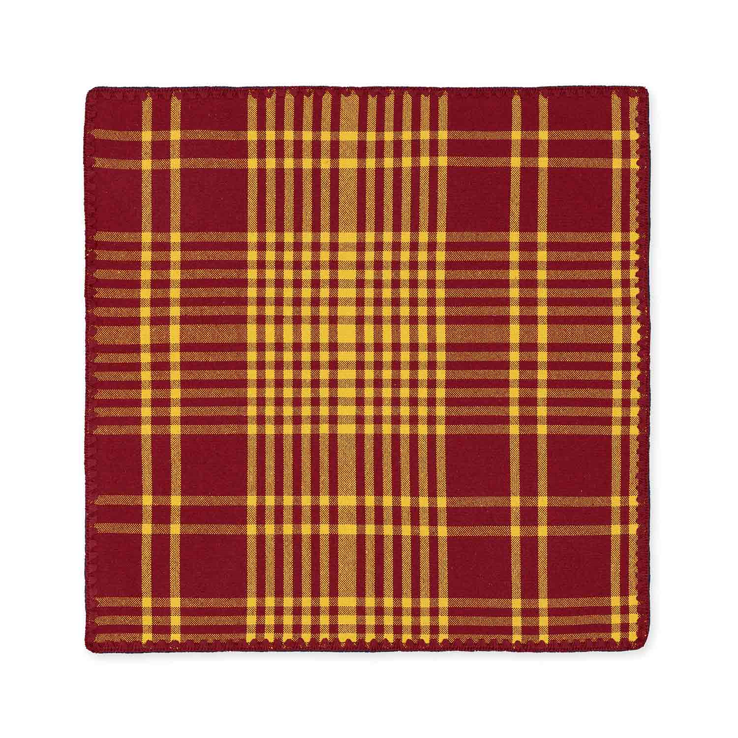 A flat cotton check jacquard napkin featuring a bordeaux and yellow plaid pattern with contrasting detail stitching.