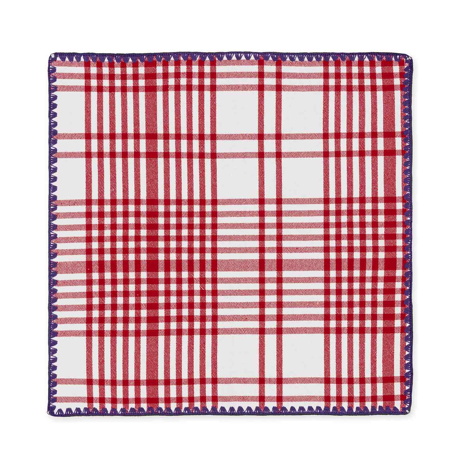 A flat cotton check jacquard napkin featuring a red and purple plaid pattern with contrasting detail stitching.
