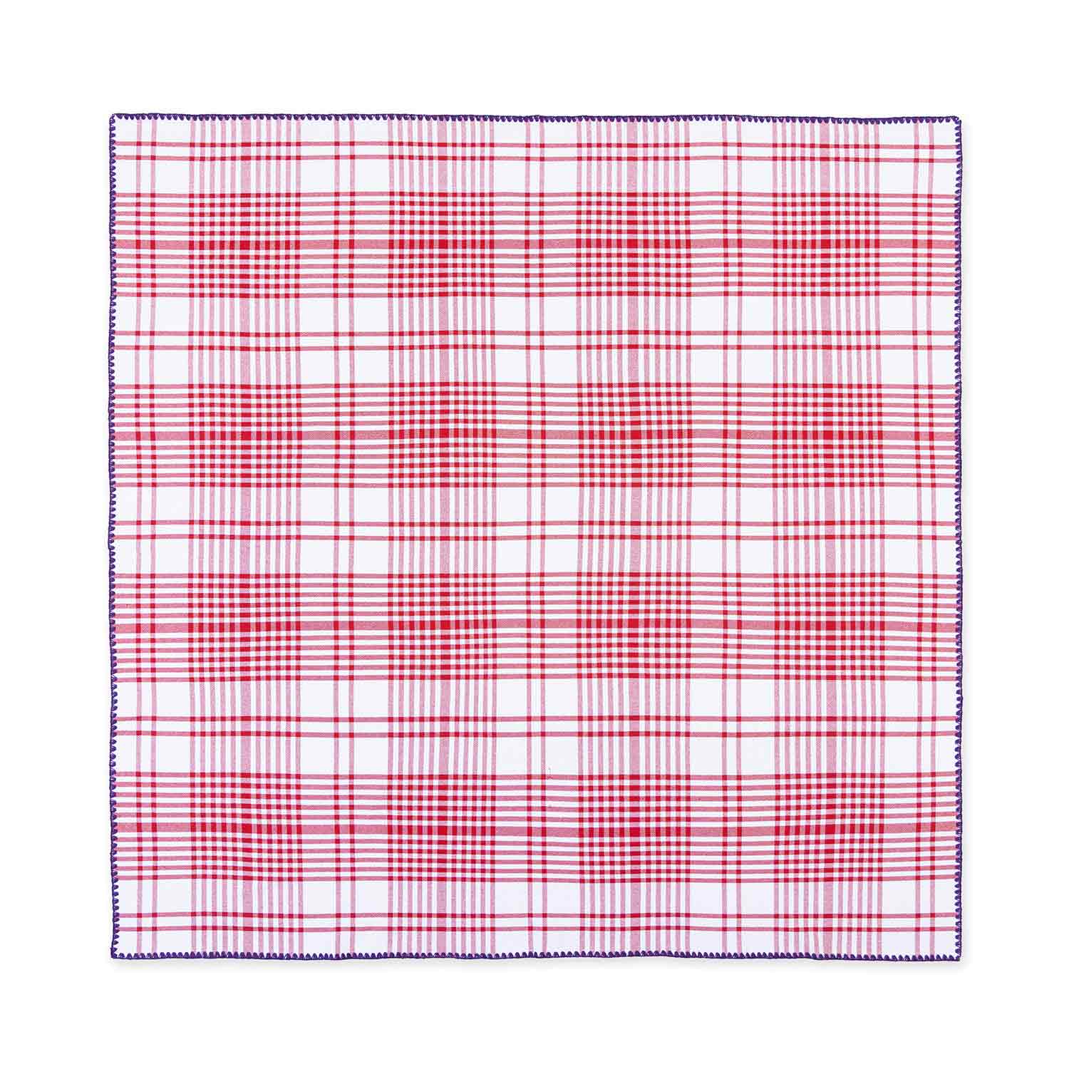 A flat red and purple checkered tablecloth with contrasting detail stitching and a purple border.