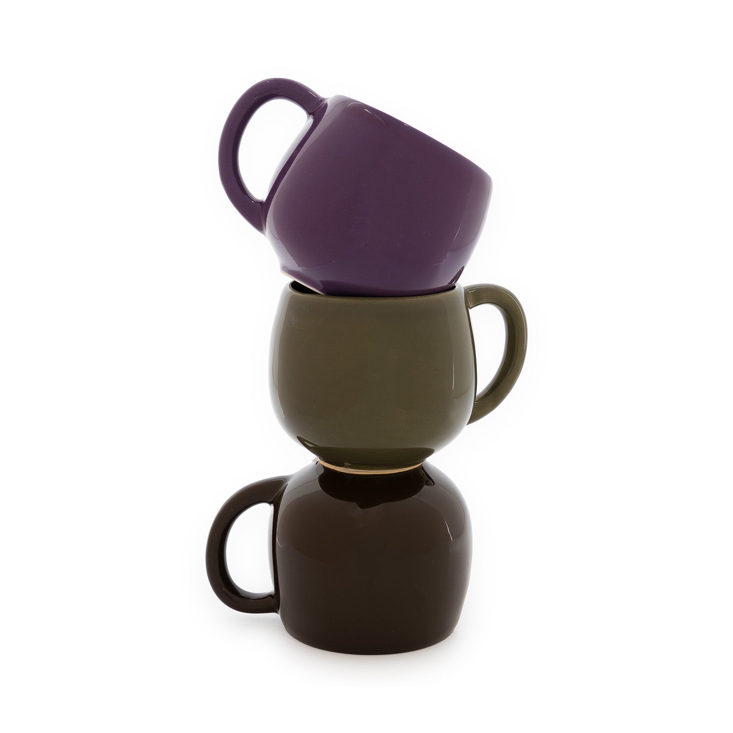 Three ceramic mugs in shades of green, brown and purple, stacked on top of one another.