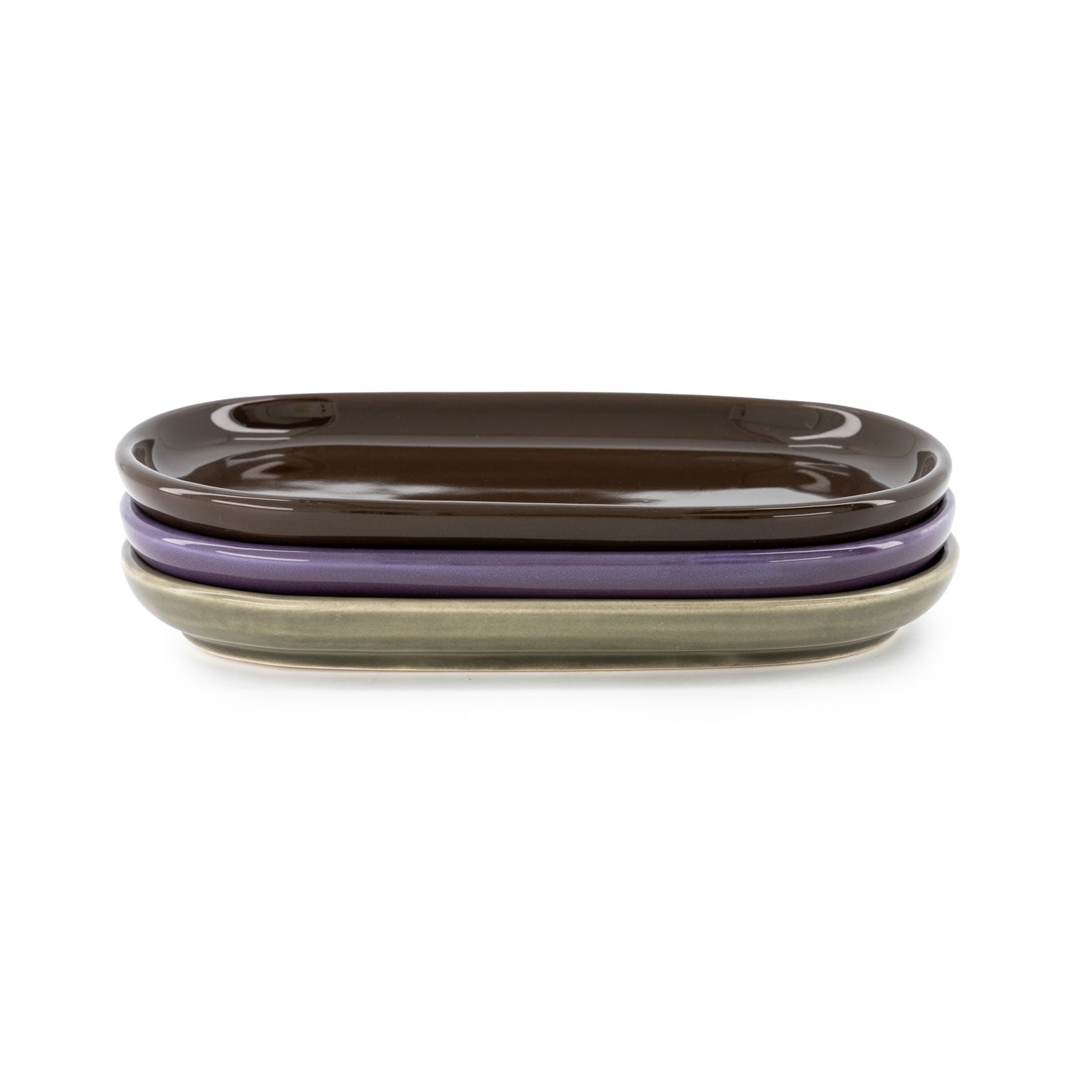 Three ceramic trays, each in a different colour: brown, purple and green, with a high-gloss finish