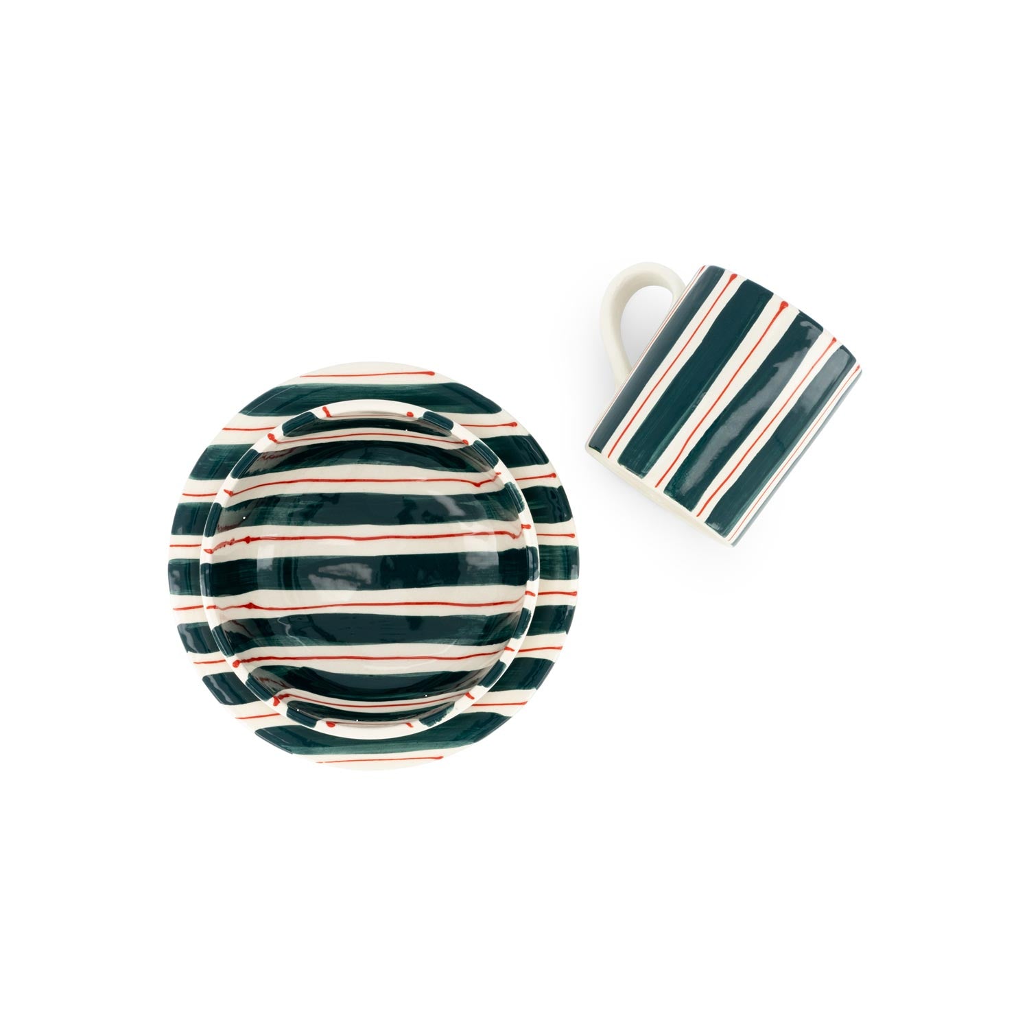 White plate, bowl and mug with red and green stripes on a white background.