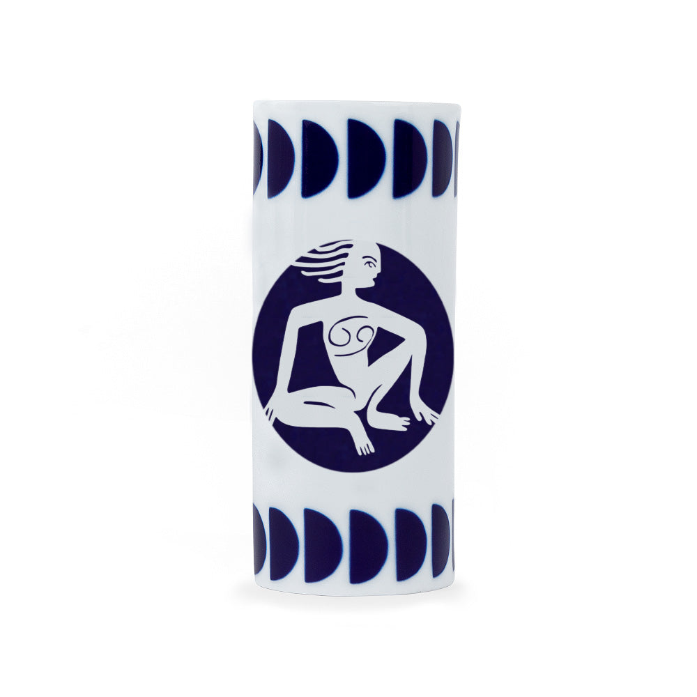 A white porcelain pencil holder with a navy blue zodiac cancer sign design, crafted in Spain.