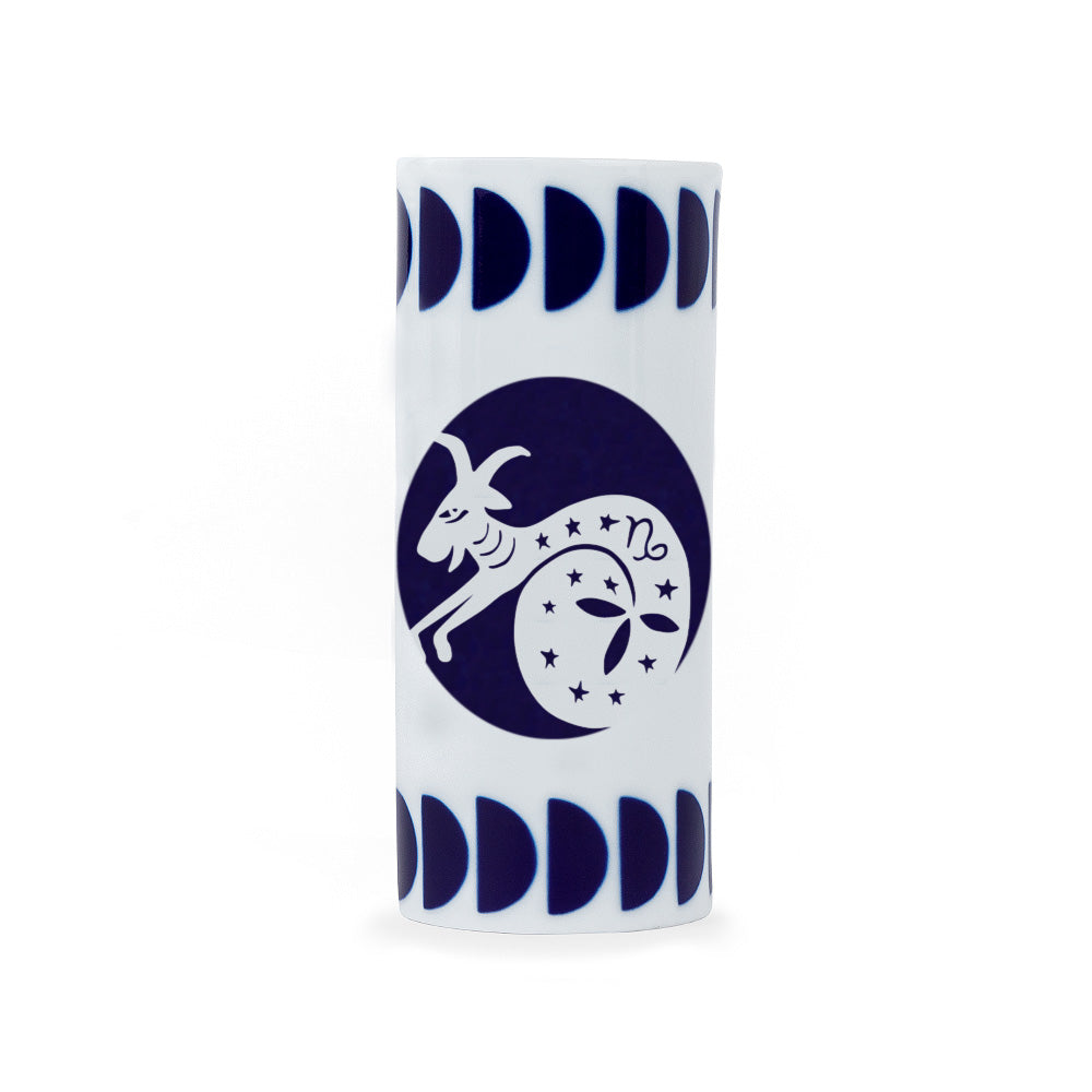 A white porcelain pencil holder with a navy blue zodiac capricorn sign design, crafted in Spain.