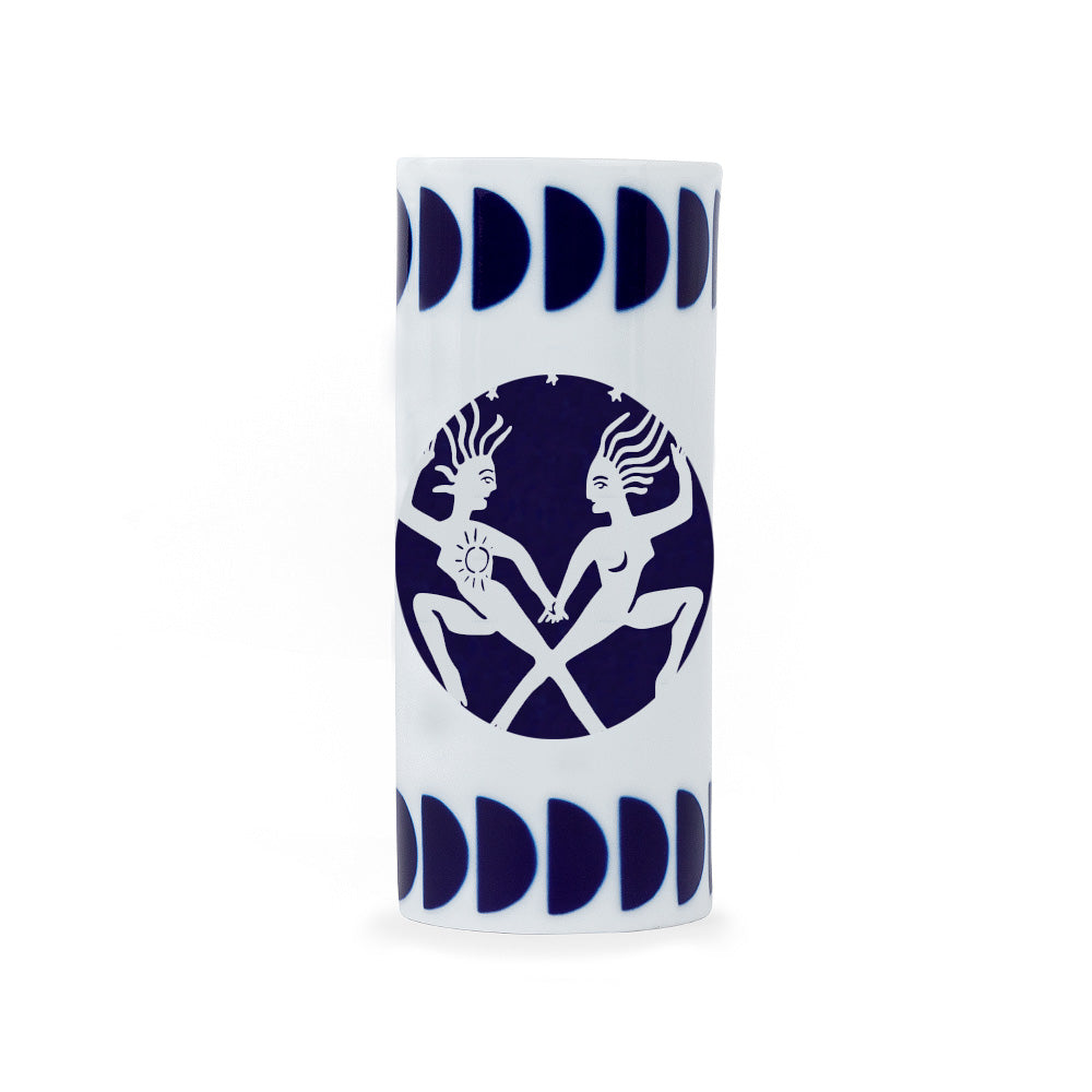 A white porcelain pencil holder with a navy blue zodiac gemini sign design, crafted in Spain.
