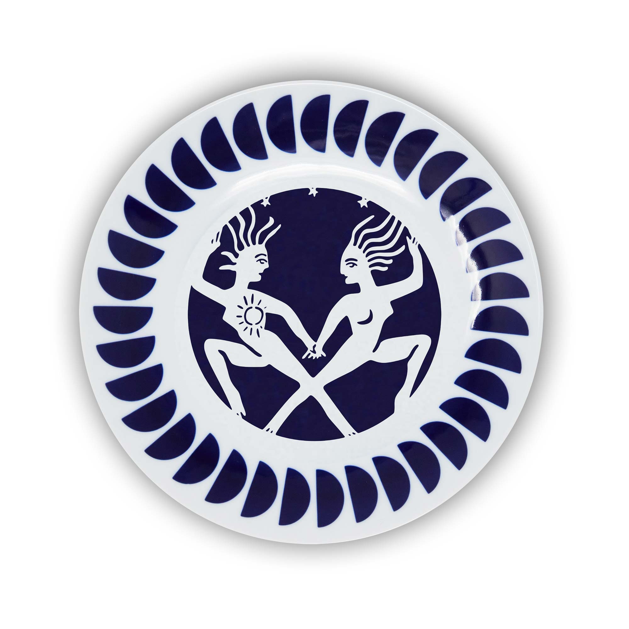 A round porcelain plate with a navy and white design featuring an illustration of the Gemini sign of the zodiac.