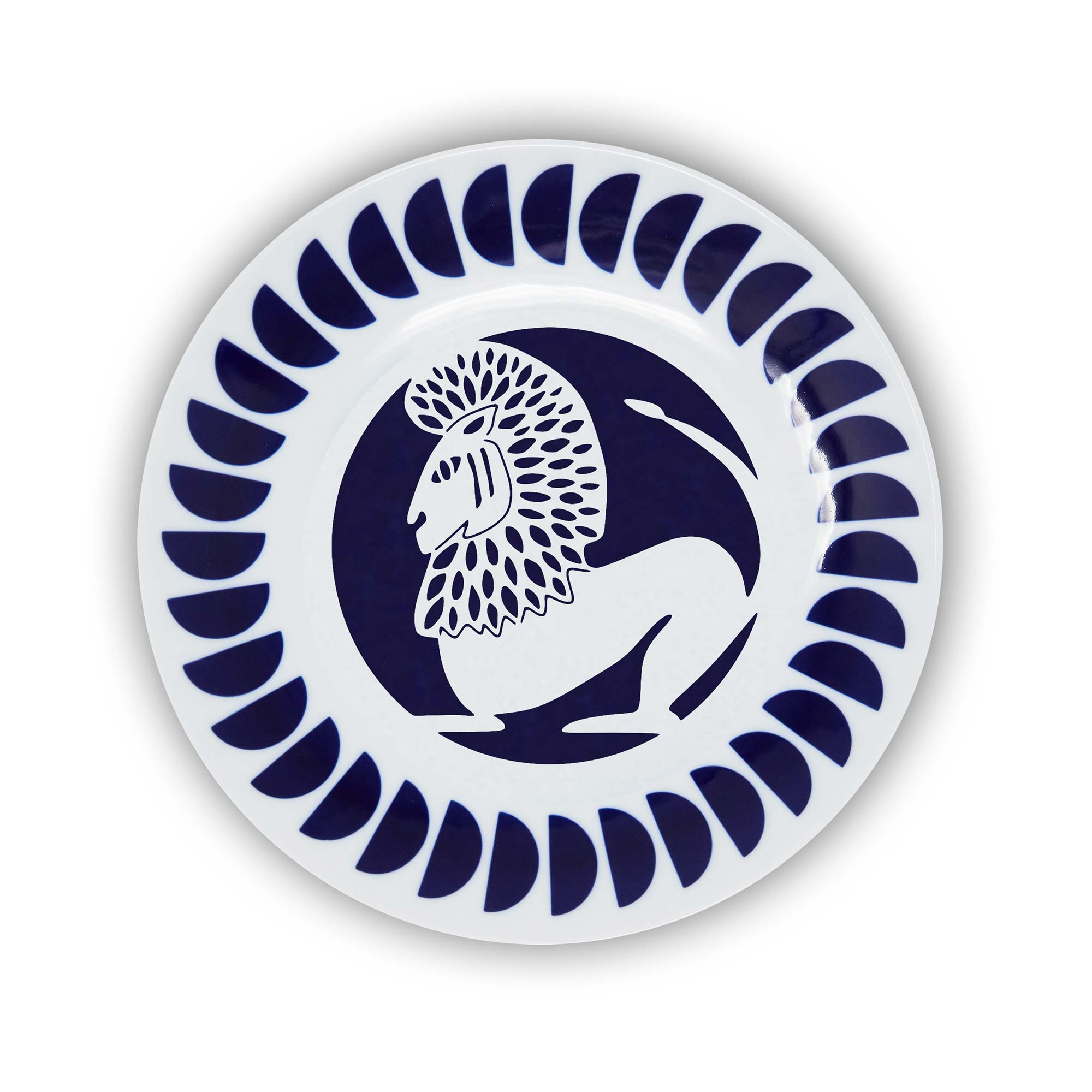 A round porcelain plate with a navy and white design featuring an illustration of the Leo sign of the zodiac.