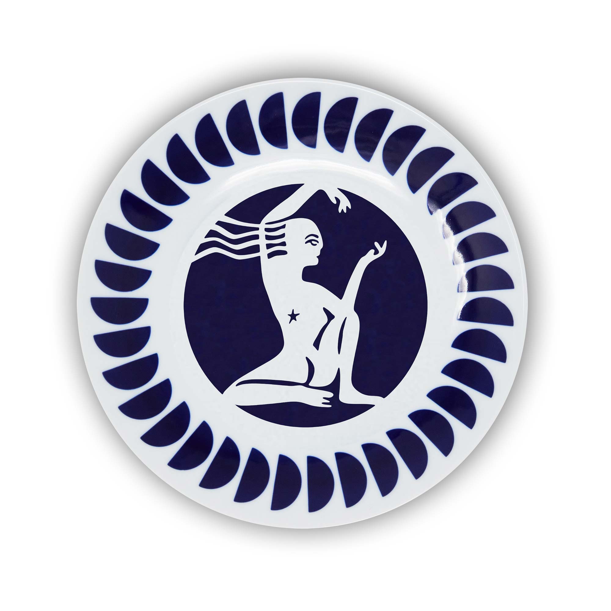 A round porcelain plate with a navy and white design featuring an illustration of the Scorpio sign of the zodiac.