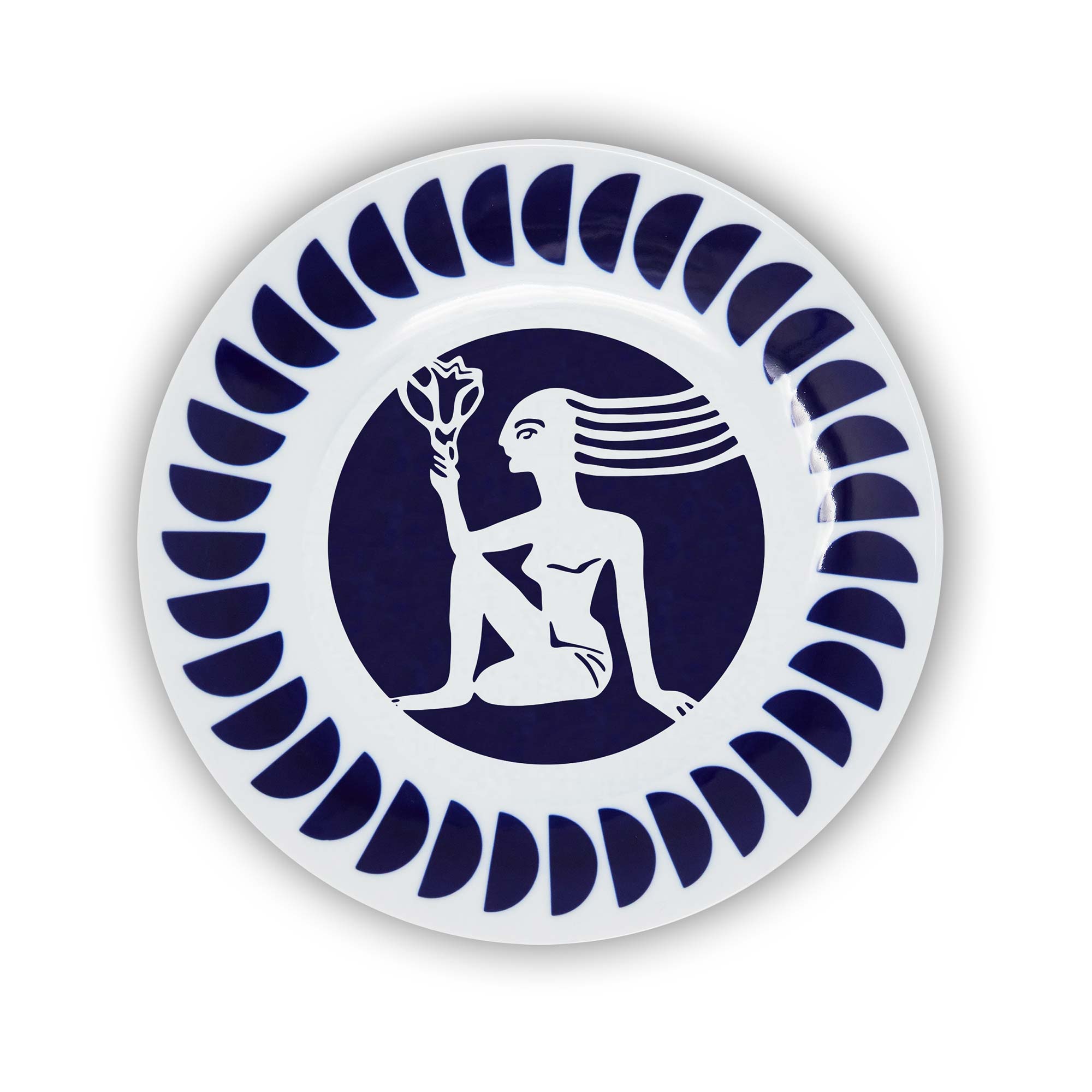 A round porcelain plate with a navy and white design featuring an illustration of the Virgo sign of the zodiac.