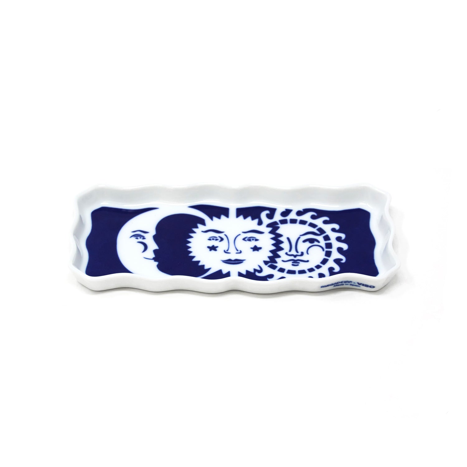 A rectangular porcelain tray with navy blue and white celestial designs, likely used for serving food or as a decorative piece.