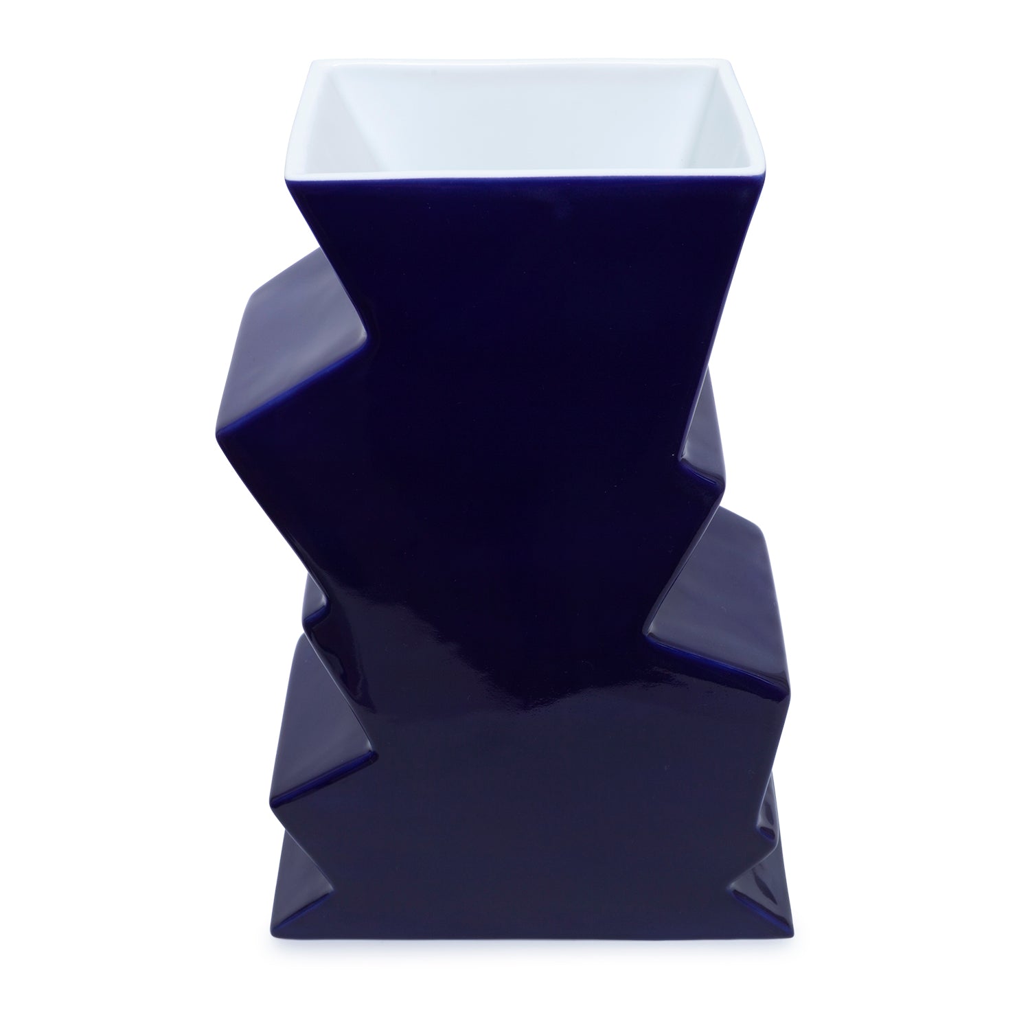 A navy porcelain vase in a zigzag shape.