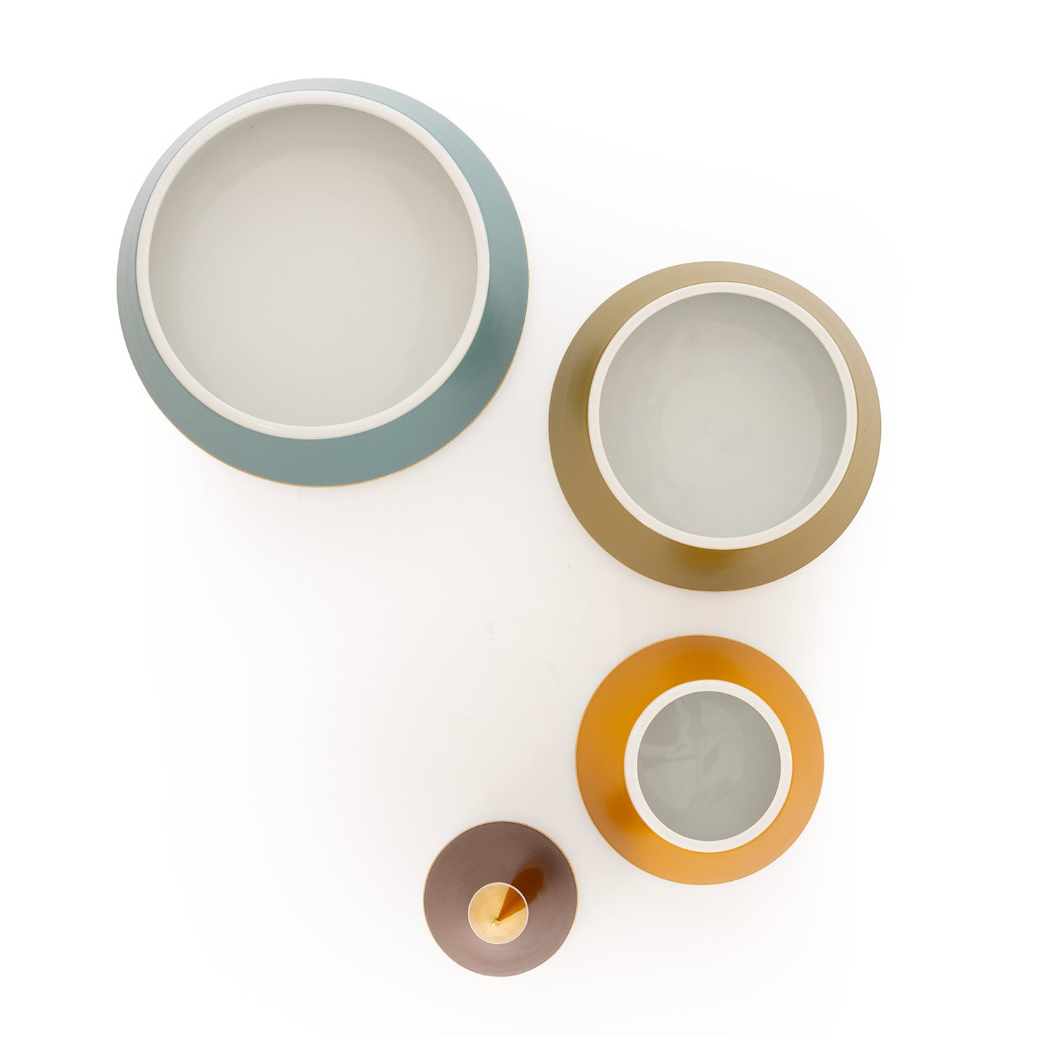 A multicoloured porcelain jewellery pyramid with gold-plated details, featuring layers of brown, green, blue and mustard yellow separated into different blocks.