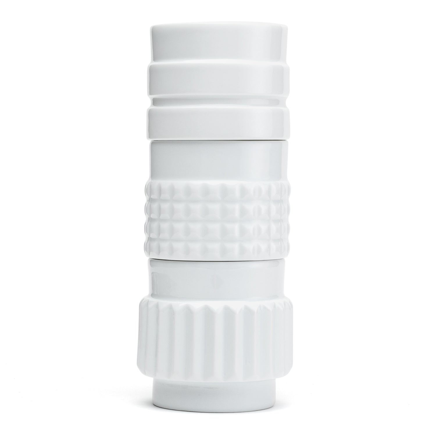 A set of white porcelain cups with a shape reminiscent of the various forms of nuts.