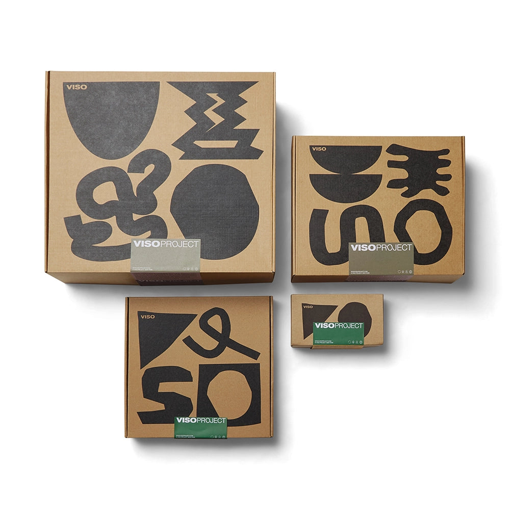 Set of four cardboard boxes with abstract designs and 'Viso Project' branding on a white background.