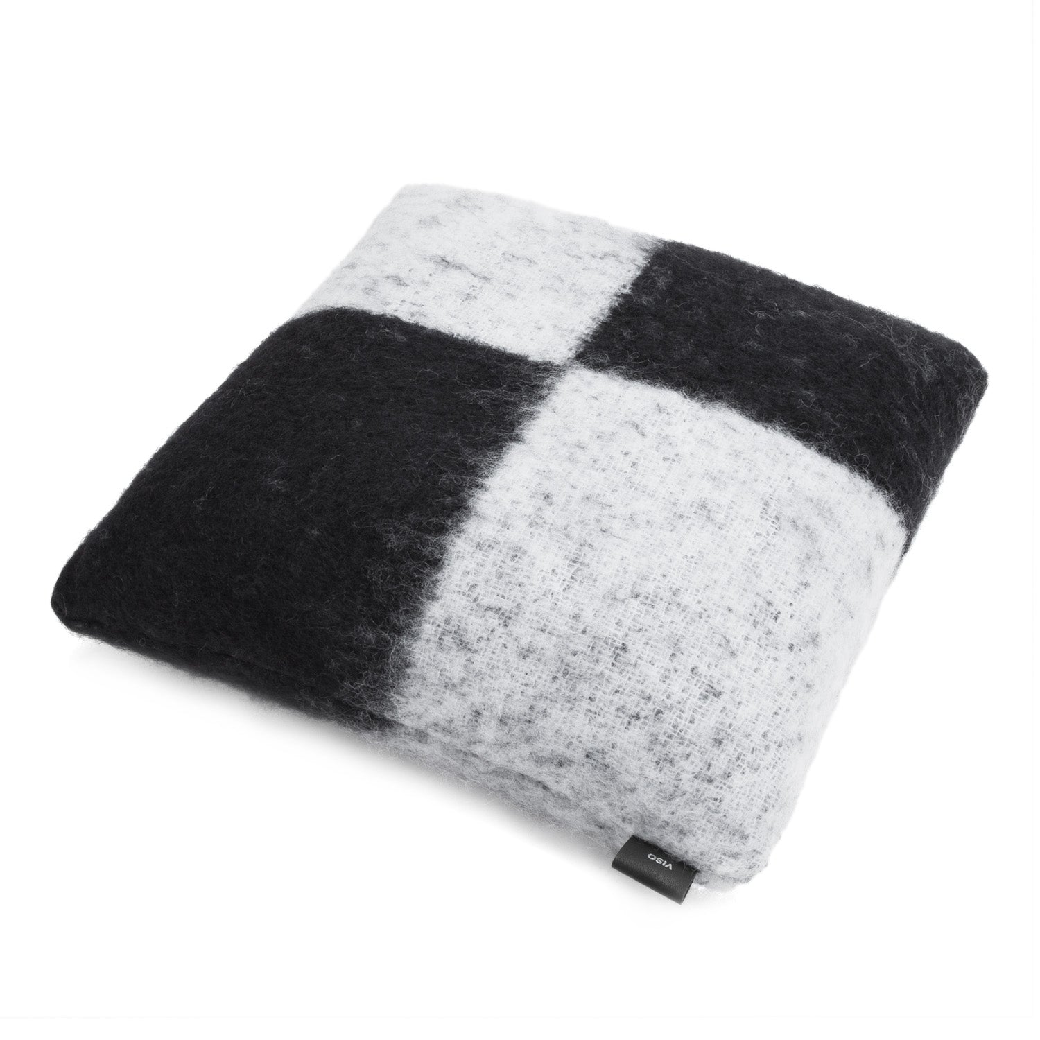 A black and white checkered mohair pillow