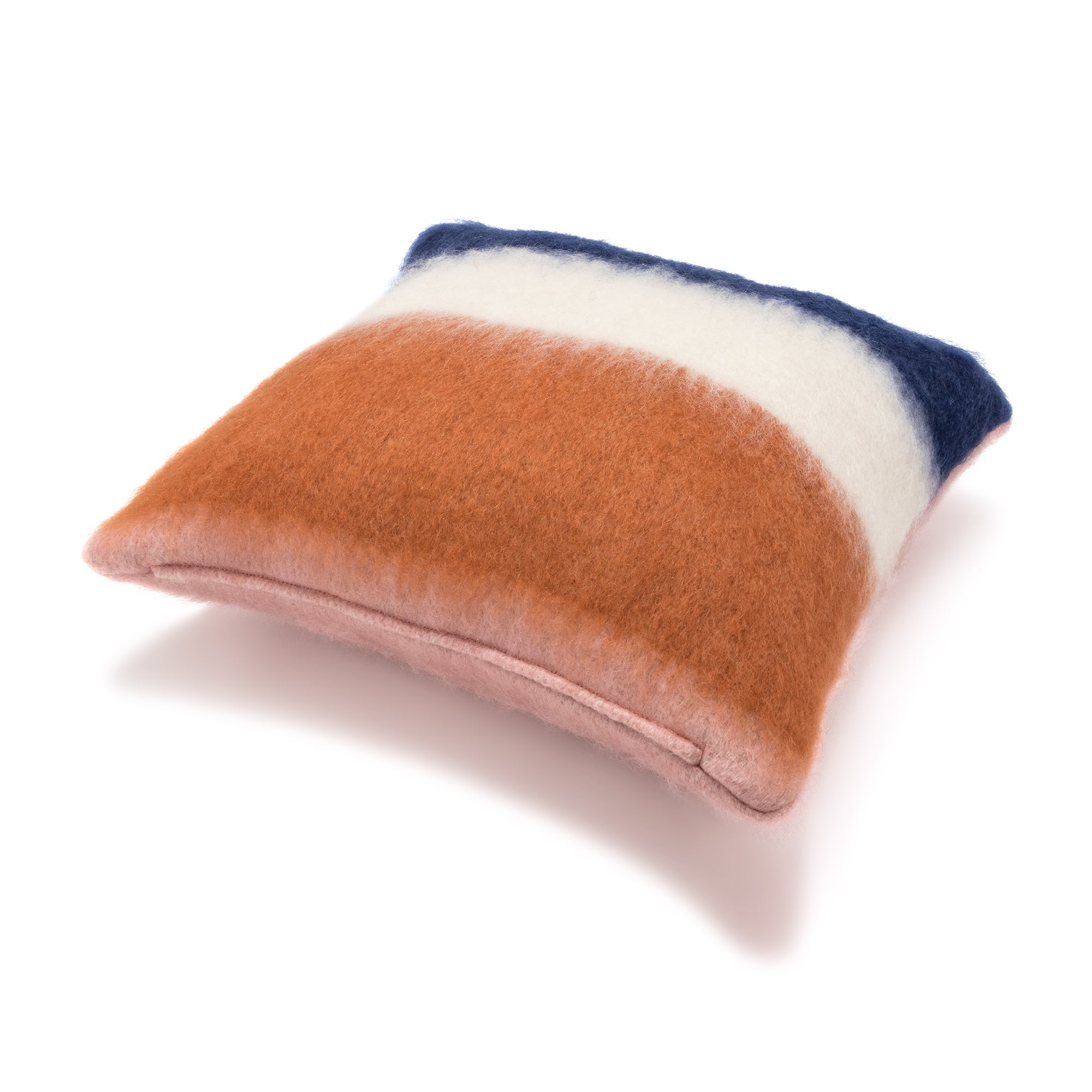 A square-shaped mohair pillow with a thick, soft texture featuring horizontal stripes in navy, white, orange, and pink colors.