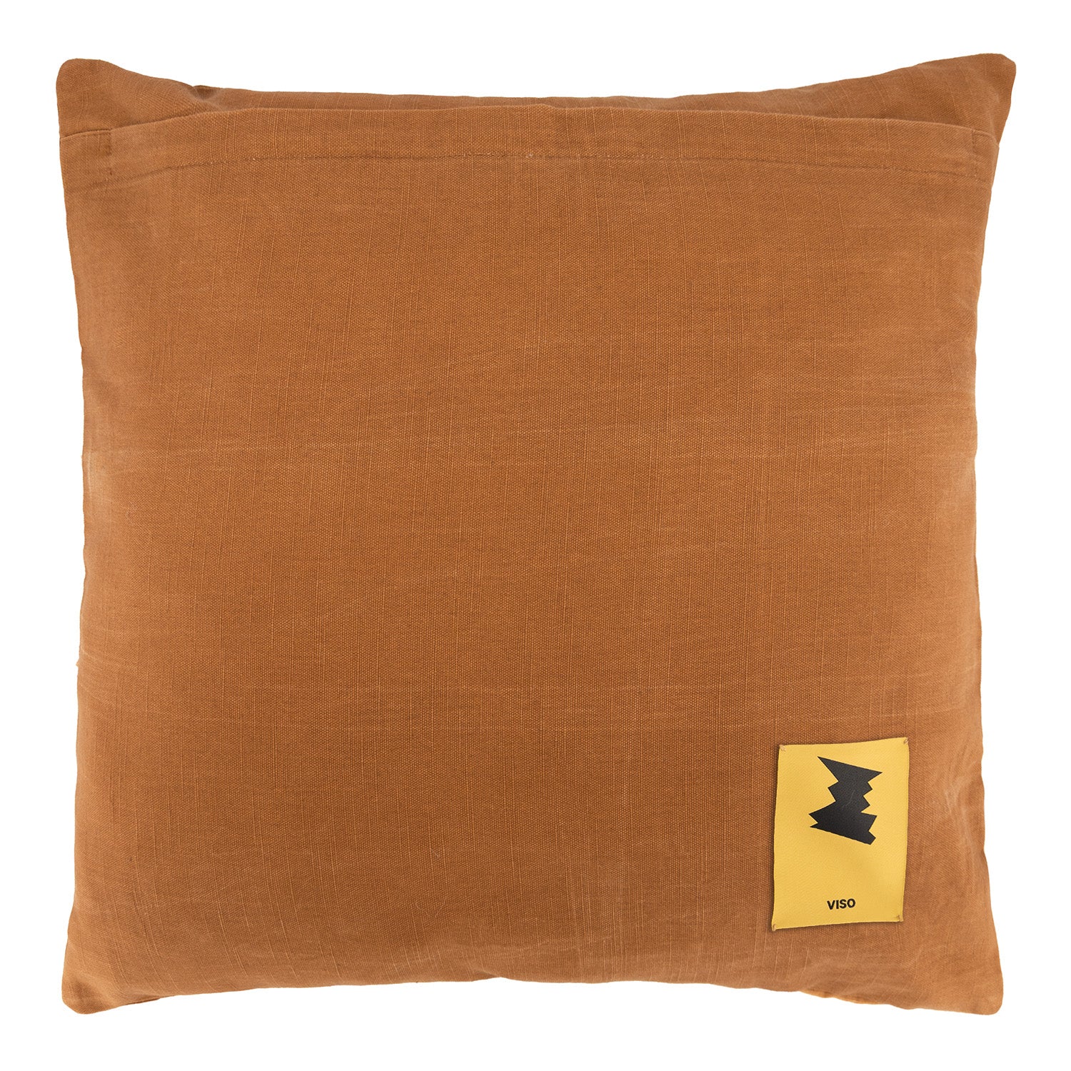Brown linen botanical pillow with a yellow label on a white background
