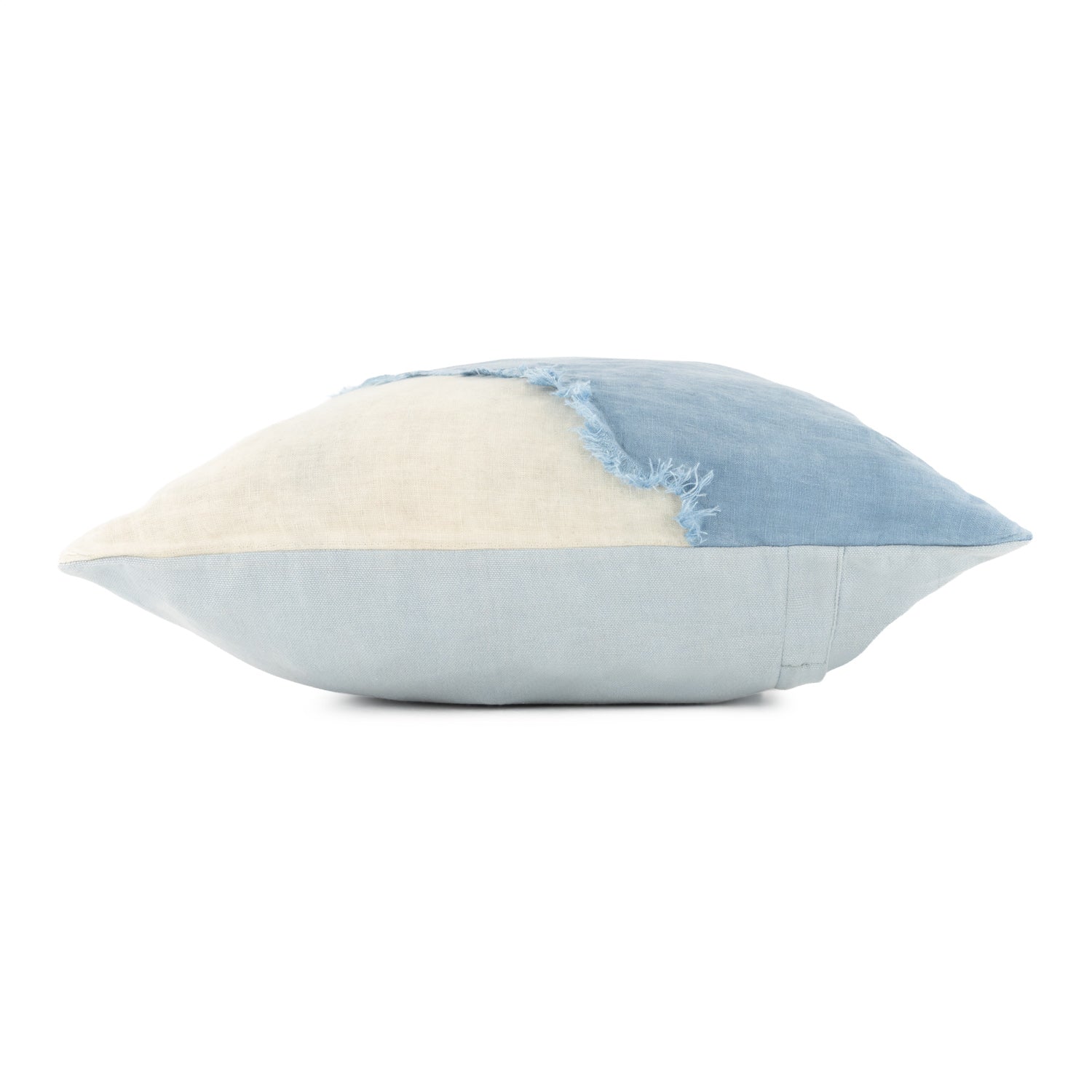 Two-toned pillow with light blue and beige sections on a white background