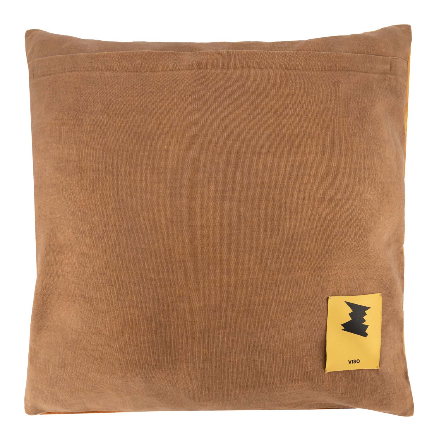 Brown pillow with a yellow label featuring a black logo on a white background