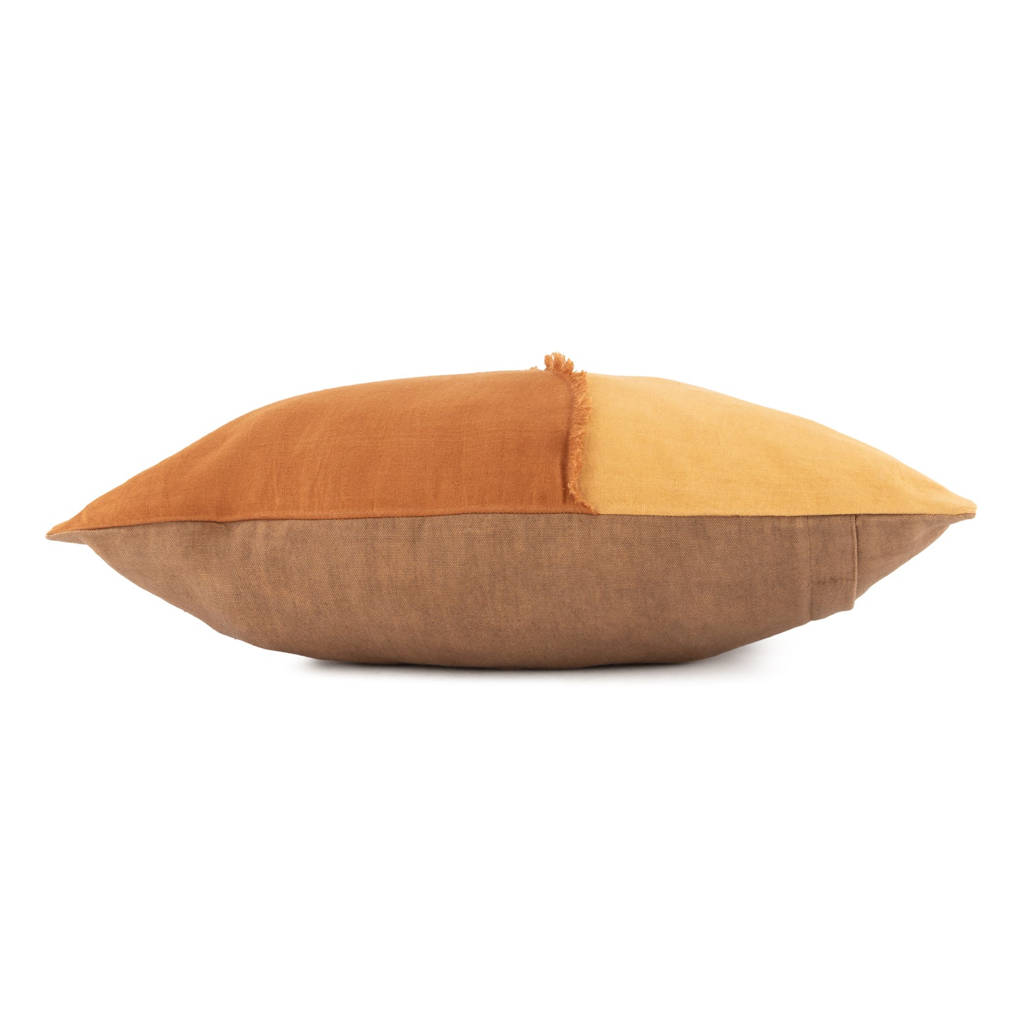 Multicolored linen botanical pillow with orange, yellow, and brown sections on a white background