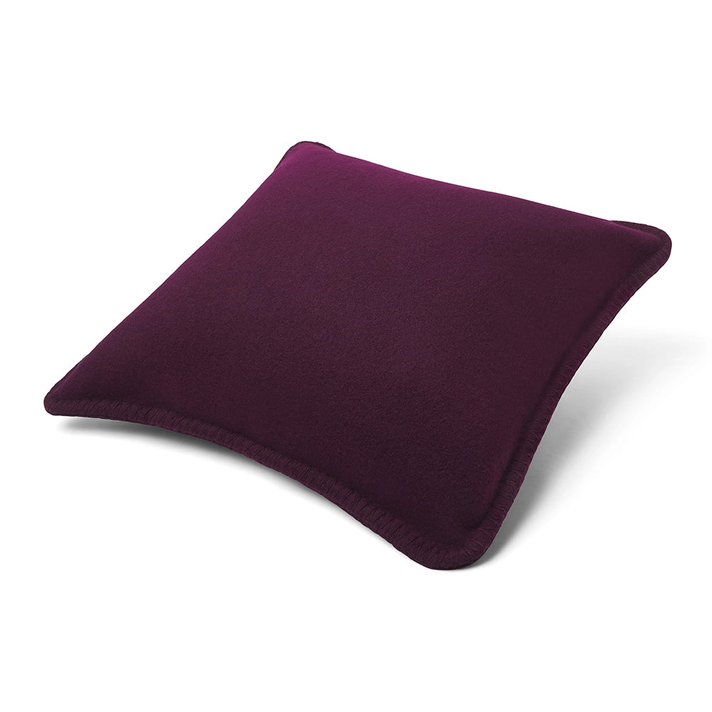 Purple merino pillow on a white background