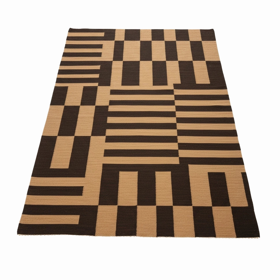 Checkered rug with black and beige pattern on a white background